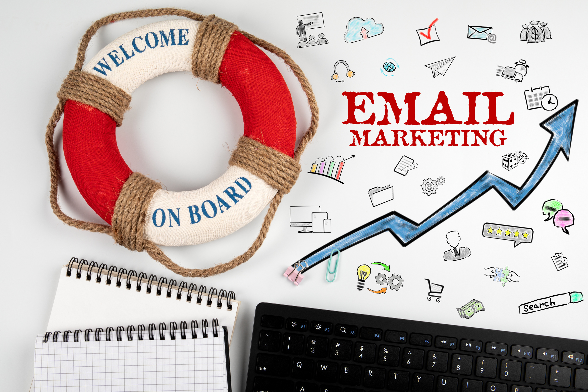 EMAIL MARKETING concept.  Lifebuoy with text and a black keyboard