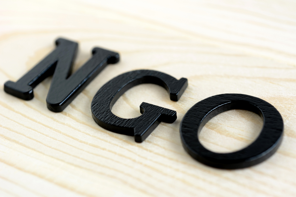 NGO letters on wood background